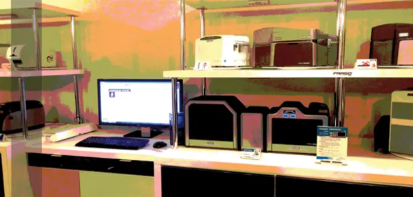 Corporations benefit outsourcing employee ID card production